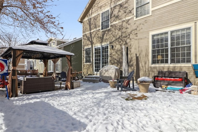 snow covered property featuring a gazebo and outdoor lounge area