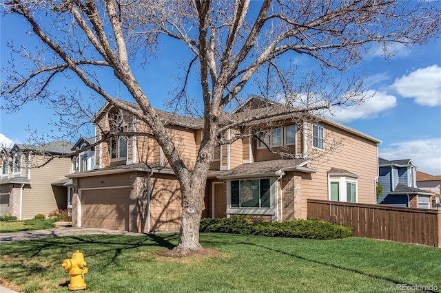 traditional-style house with an attached garage, brick siding, and concrete driveway
