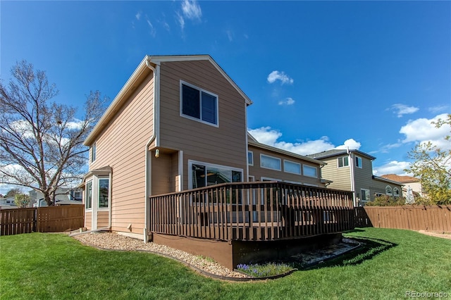 rear view of property featuring a deck