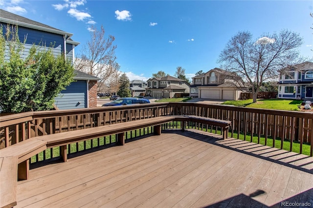 wooden deck featuring a residential view and fence