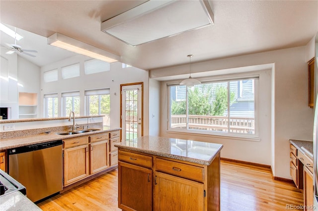 kitchen with a sink, dishwasher, plenty of natural light, and ceiling fan