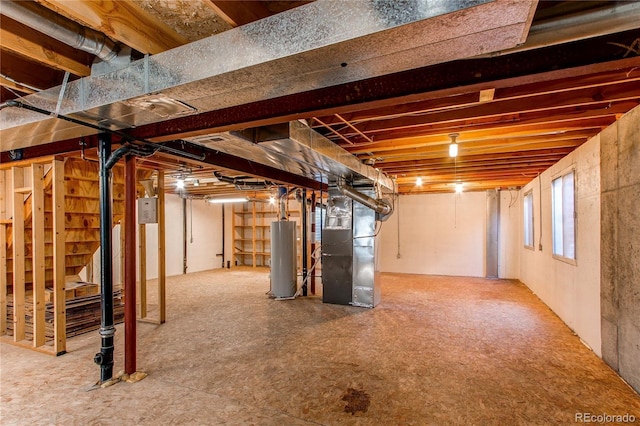 495 Bexley St, Highlands Ranch, CO 80126 - below grade area with water heater, heating unit, and stairs