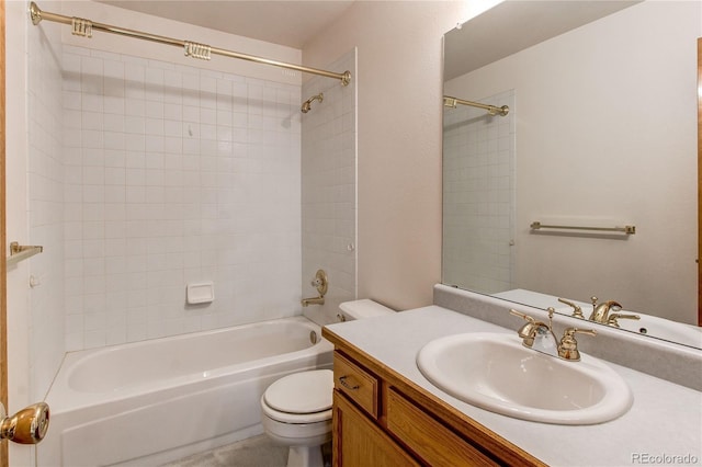 full bathroom with toilet, vanity, and washtub / shower combination
