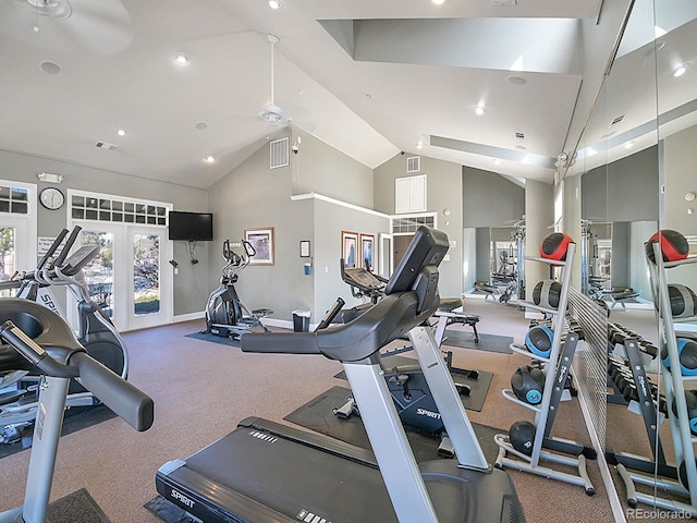 exercise room featuring a ceiling fan, visible vents, high vaulted ceiling, and baseboards