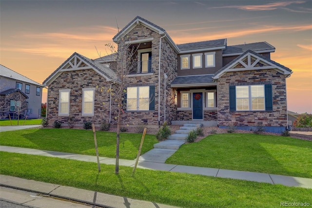 craftsman-style house with a lawn