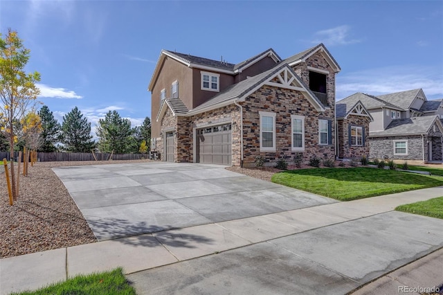 view of front of home featuring a front yard and a garage