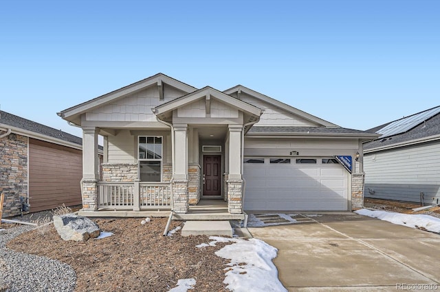 view of front of property with a garage and covered porch