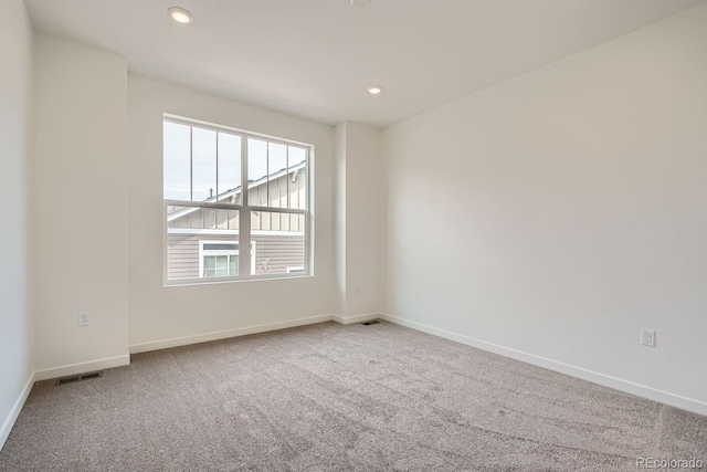 unfurnished room with carpet flooring