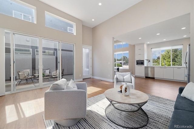 1340 W 68th Ave, Denver, CO 80221 - living area featuring light wood finished floors, recessed lighting, and a high ceiling