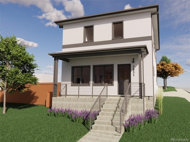 view of front of home with a front lawn and stairway