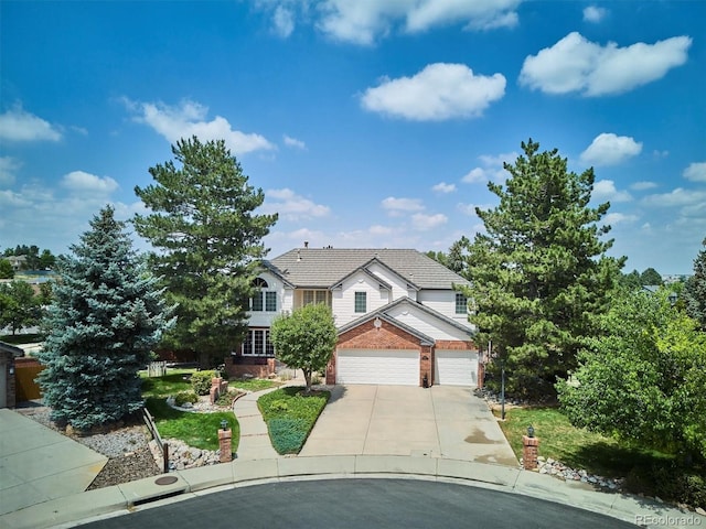 9416 Kemper Dr, Lone Tree, CO 80124 - traditional-style house with brick siding, driveway, and an attached garage