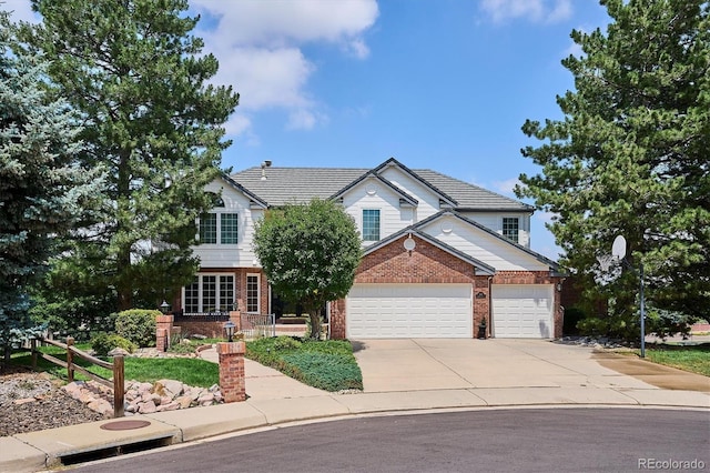 9416 Kemper Dr, Lone Tree, CO 80124 - view of front of home featuring brick siding, concrete driveway, and a garage