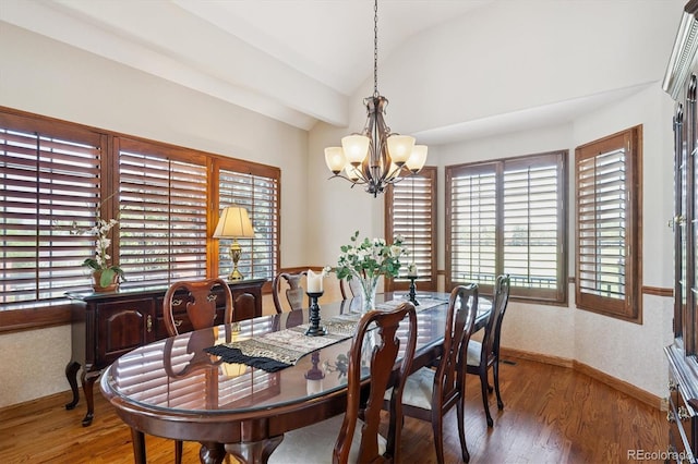9416 Kemper Dr, Lone Tree, CO 80124 - dining area featuring lofted ceiling, a chandelier, and wood finished floors