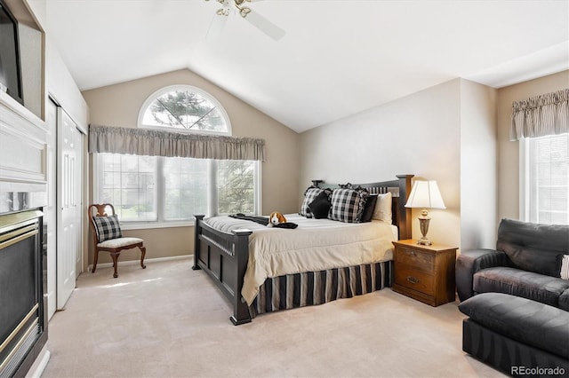 9416 Kemper Dr, Lone Tree, CO 80124 - bedroom featuring light colored carpet, vaulted ceiling, a closet, and a ceiling fan