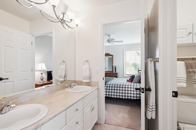 9416 Kemper Dr, Lone Tree, CO 80124 - ensuite bathroom with double vanity and a chandelier