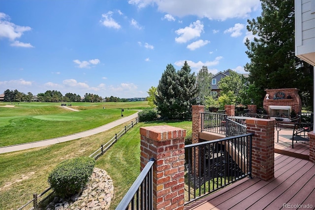 9416 Kemper Dr, Lone Tree, CO 80124 - wooden deck with an outdoor brick fireplace and view of golf course