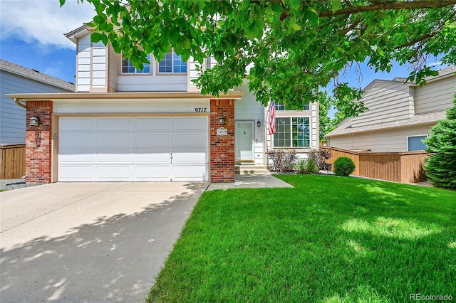 9717 Castle Ridge Cir, Highlands Ranch, CO 80129 - traditional home featuring driveway, brick siding, and a garage