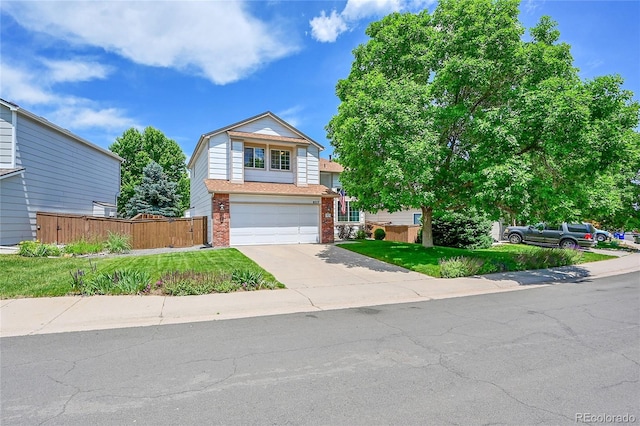 9717 Castle Ridge Cir, Highlands Ranch, CO 80129 - view of front facade featuring brick siding, concrete driveway, and a garage
