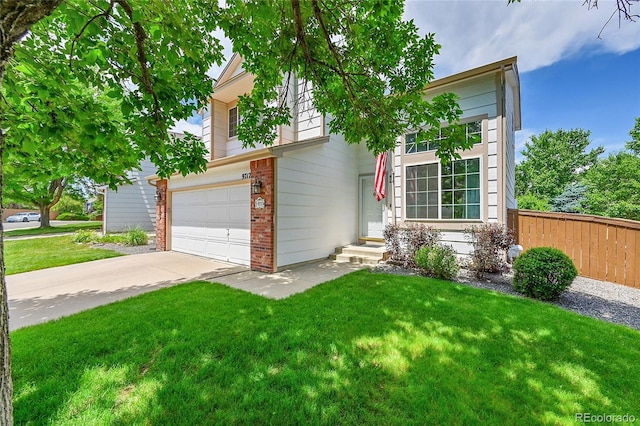 9717 Castle Ridge Cir, Highlands Ranch, CO 80129 - view of front of property with brick siding, driveway, and a garage