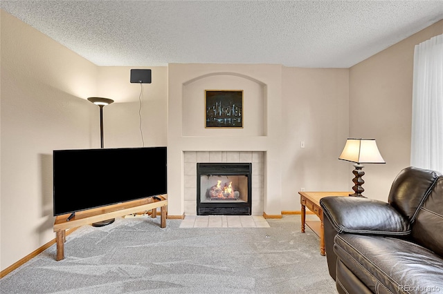 9717 Castle Ridge Cir, Highlands Ranch, CO 80129 - living room featuring carpet, a textured ceiling, and a tile fireplace