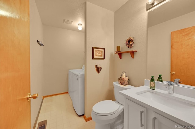 9717 Castle Ridge Cir, Highlands Ranch, CO 80129 - bathroom featuring vanity and independent washer and dryer