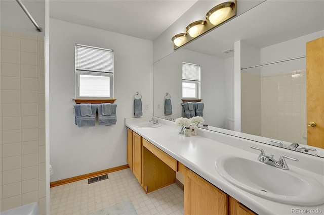 9717 Castle Ridge Cir, Highlands Ranch, CO 80129 - full bathroom featuring double vanity and tile patterned floors