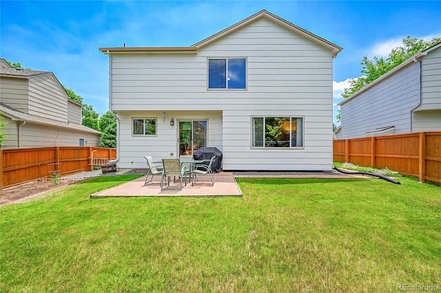 9717 Castle Ridge Cir, Highlands Ranch, CO 80129 - back of property with a fenced backyard and a patio