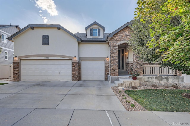 view of front of property with a garage