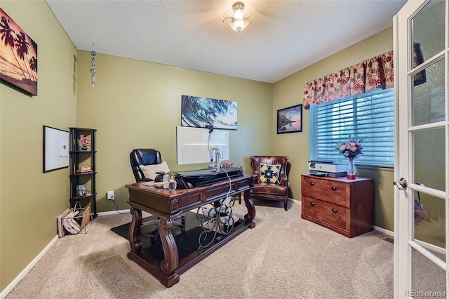 carpeted office with a textured ceiling