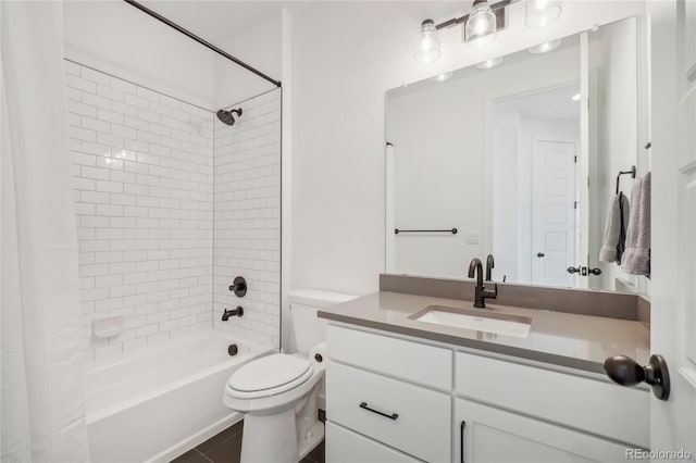 full bathroom featuring vanity, tile patterned floors, toilet, and shower / bath combo with shower curtain