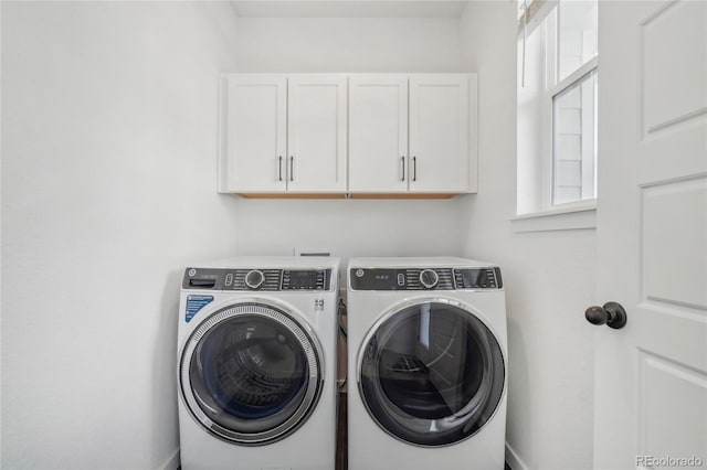 laundry room featuring cabinet space and washing machine and clothes dryer