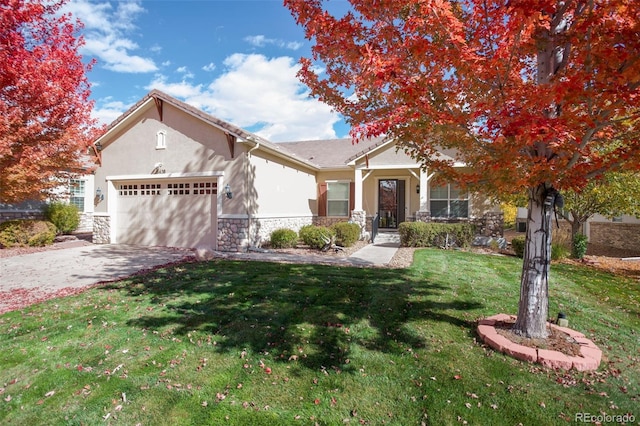 view of front of home with a garage and a front yard