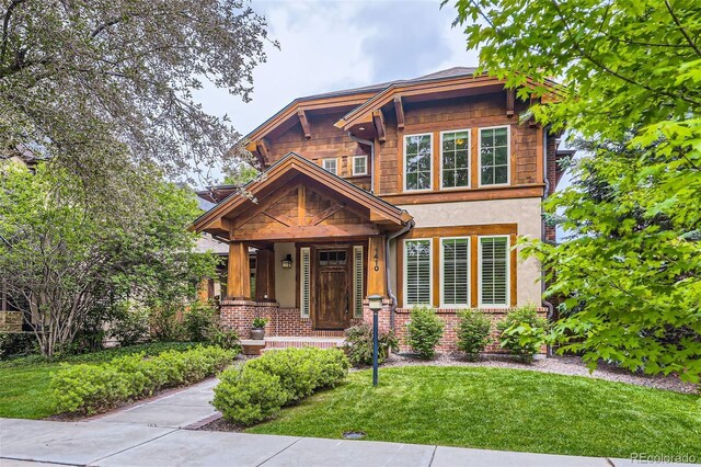 1410 S Elizabeth St, Denver, CO 80210 - craftsman inspired home featuring a front lawn, stucco siding, and a porch