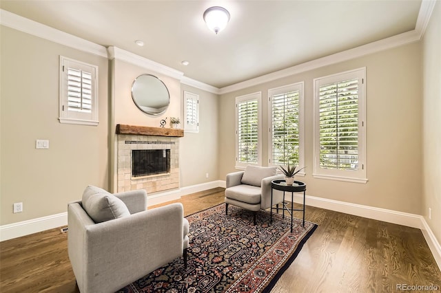 1410 S Elizabeth St, Denver, CO 80210 - living room featuring baseboards, a tile fireplace, crown molding, and wood finished floors