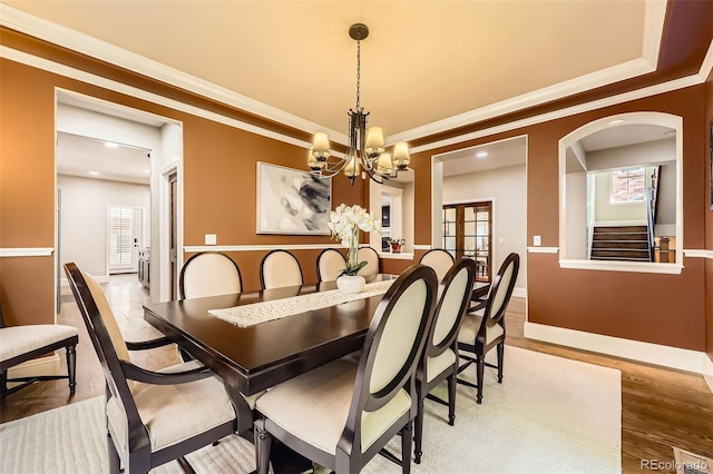 1410 S Elizabeth St, Denver, CO 80210 - dining room featuring a chandelier, ornamental molding, wood finished floors, baseboards, and stairs