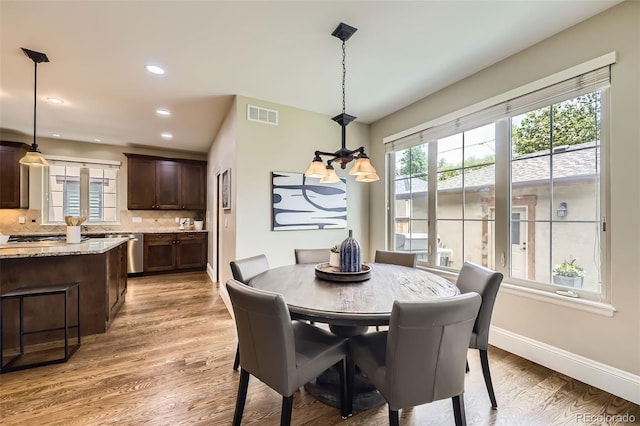 1410 S Elizabeth St, Denver, CO 80210 - dining space featuring plenty of natural light, light wood-style flooring, baseboards, and recessed lighting