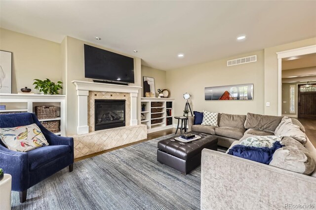 1410 S Elizabeth St, Denver, CO 80210 - living room featuring wood finished floors, a fireplace, and recessed lighting