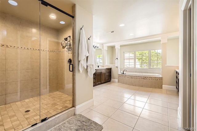 1410 S Elizabeth St, Denver, CO 80210 - full bathroom with vanity, a garden tub, a shower stall, tile patterned floors, and recessed lighting
