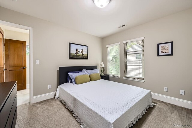 1410 S Elizabeth St, Denver, CO 80210 - bedroom featuring baseboards and light carpet
