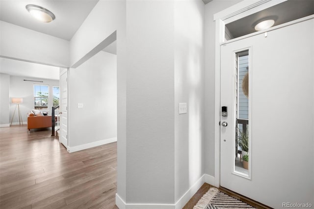 foyer entrance with light wood-type flooring