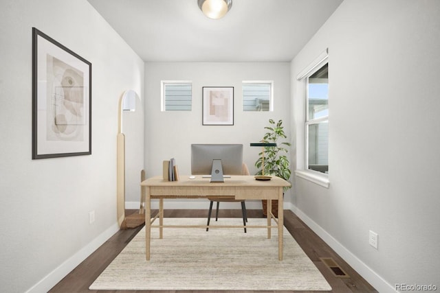 office space featuring dark hardwood / wood-style flooring