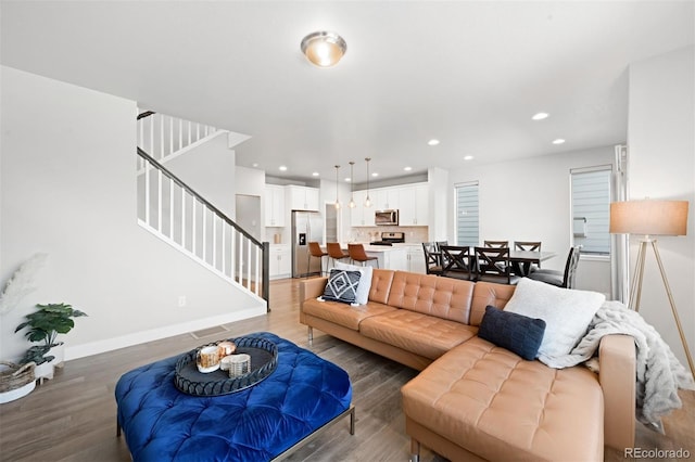 living room with dark hardwood / wood-style flooring