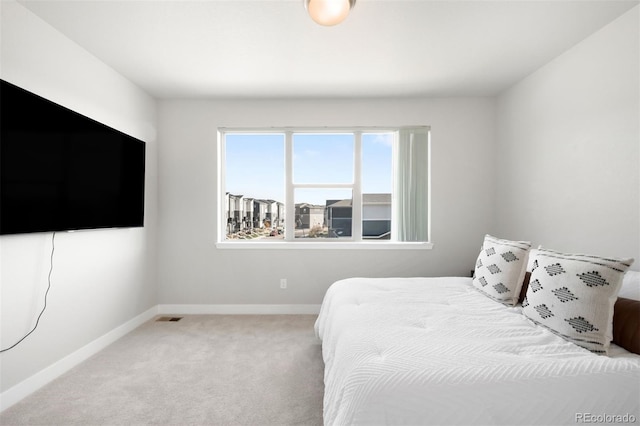 bedroom with light carpet