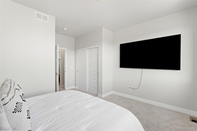 carpeted bedroom featuring a closet