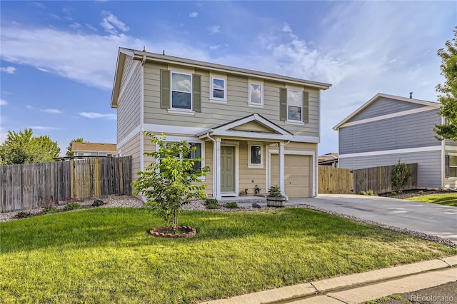 view of front property with a garage and a front lawn