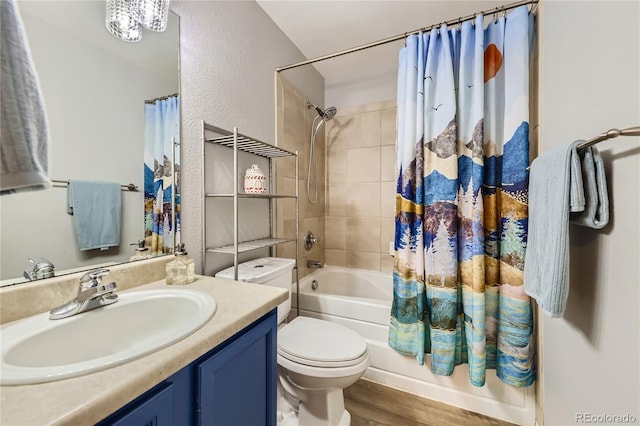 full bathroom featuring vanity, wood-type flooring, shower / bath combination with curtain, and toilet