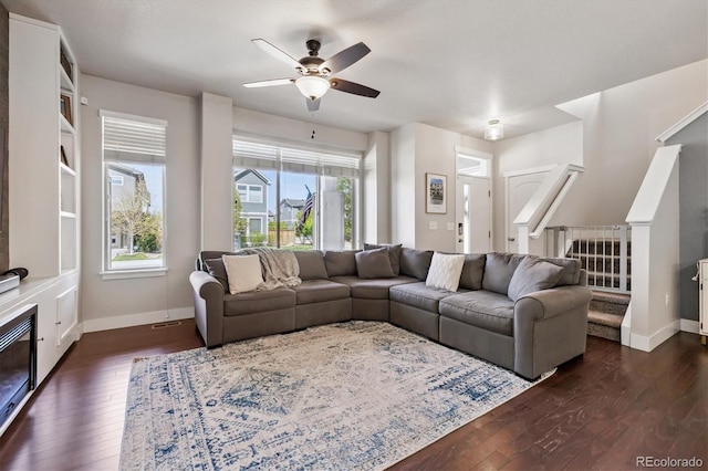 6834 Clay St N, Denver, CO 80221 - living room featuring dark wood finished floors, a ceiling fan, and stairs