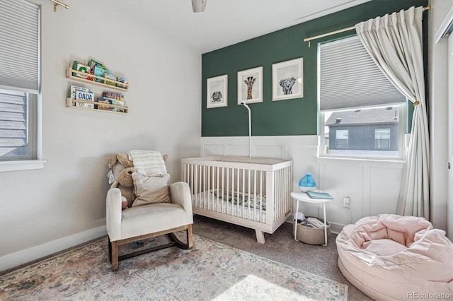 6834 Clay St N, Denver, CO 80221 - bedroom featuring a crib and carpet flooring