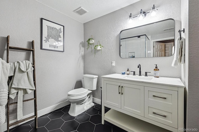 6834 Clay St N, Denver, CO 80221 - full bath with a textured wall, vanity, a textured ceiling, and tile patterned floors