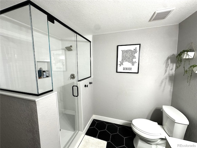 6834 Clay St N, Denver, CO 80221 - bathroom featuring tile patterned floors, a textured ceiling, a stall shower, and a textured wall